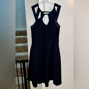 Women’s, “Betsy Johnson” mini dress, dark navy in color and size SM.